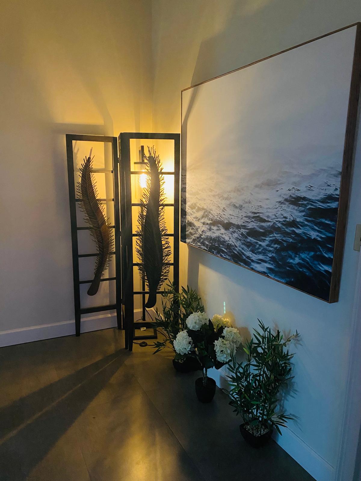 Peaceful spa treatment room with candles and natural decor